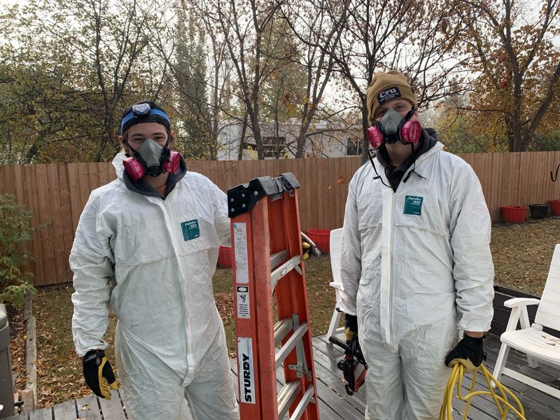Leighton and Denim in full PPE, ready for an insulation job